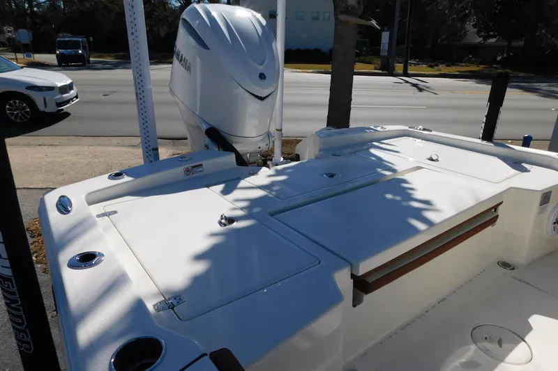 Slide: The Image of 2026 Pathfinder 2600 TRS boat with Yamaha outboard engine, parked on roadside. - 56