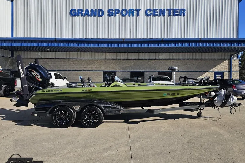 The Image of 2022 Skeeter FXR21 Apex boat at Grand Sport Center, green color, on trailer. - 1