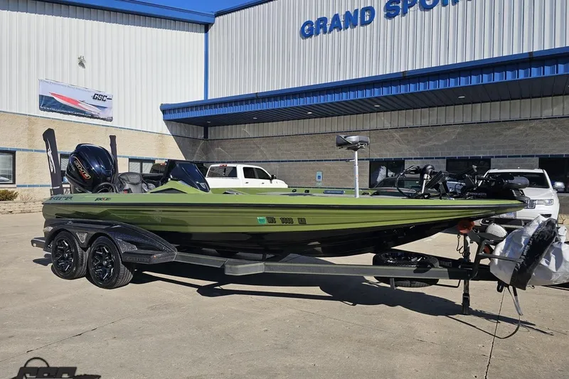 Slide: The Image of 2022 Skeeter FXR21 Apex boat on trailer outside Grand Sports Center. - 18