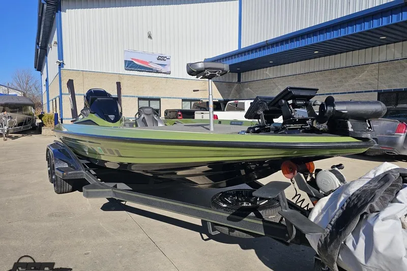 Slide: The Image of 2022 Skeeter FXR21 Apex boat on trailer outside a building. - 19