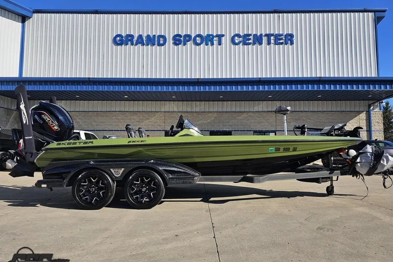 Slide: The Image of 2022 Skeeter FXR21 Apex boat at Grand Sport Center, green and black design. - 3