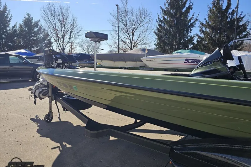 Slide: The Image of 2022 Skeeter FXR21 Apex boat on trailer in outdoor setting. - 32