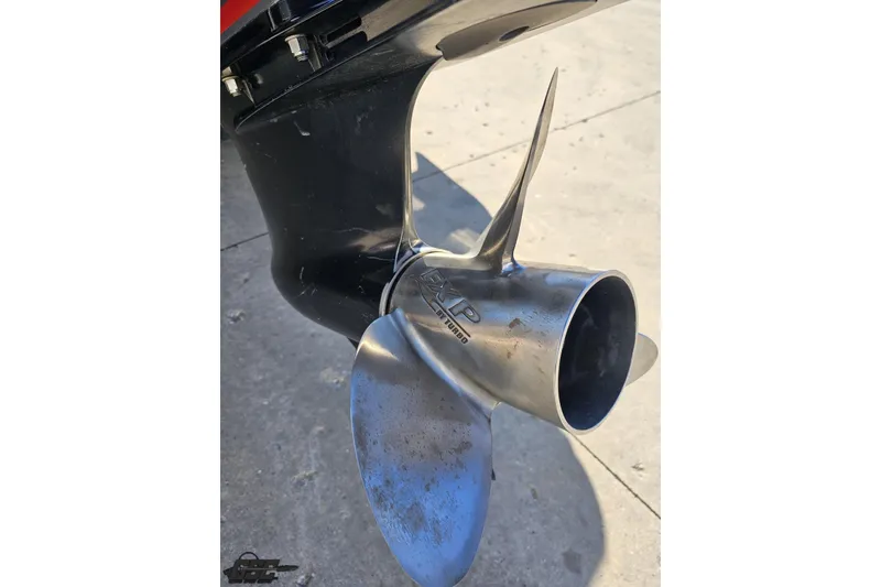 Slide: The Image of 2022 Skeeter FXR21 Apex boat propeller, close-up view on concrete surface. - 45