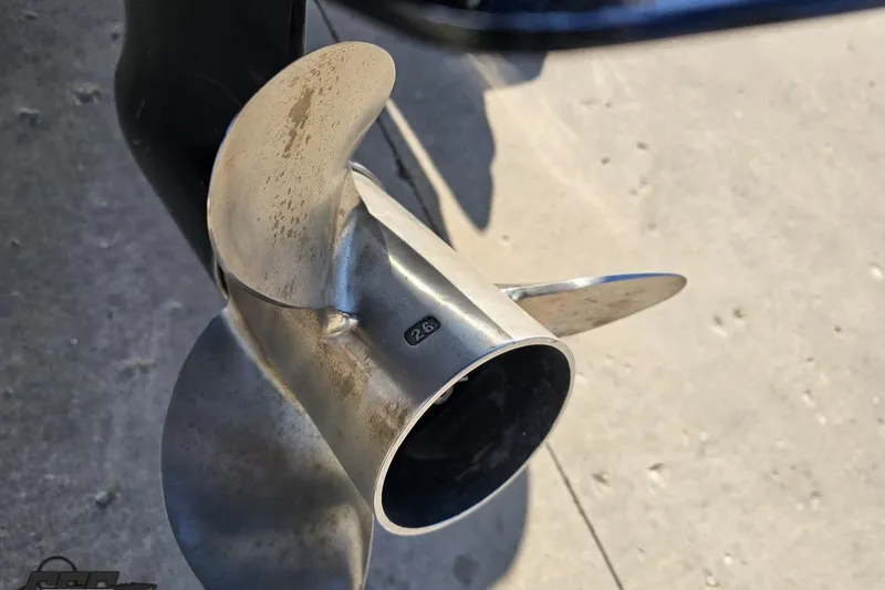 Slide: The Image of Close-up of a 2022 Skeeter FXR21 Apex boat propeller on concrete surface. - 46