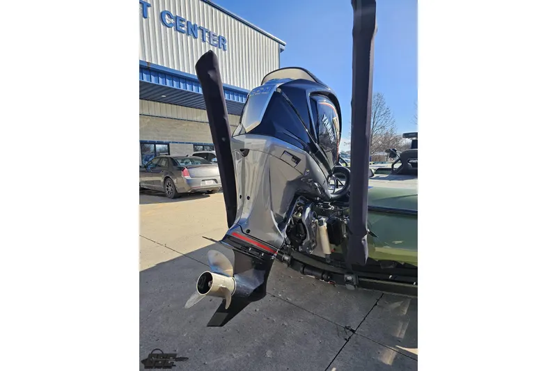 Slide: The Image of 2022 Skeeter FXR21 Apex boat with powerful outboard motor at dealership. - 47