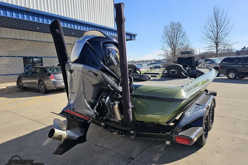 Slide: The Image of 2022 Skeeter FXR21 Apex boat with Yamaha engine on trailer in parking lot. - 48