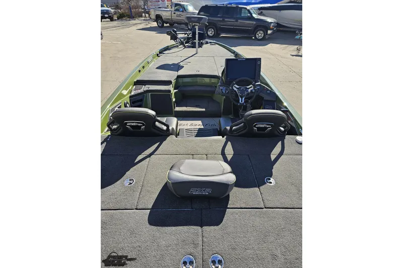 Slide: The Image of 2022 Skeeter FXR21 Apex boat interior with steering wheel and seating. - 50