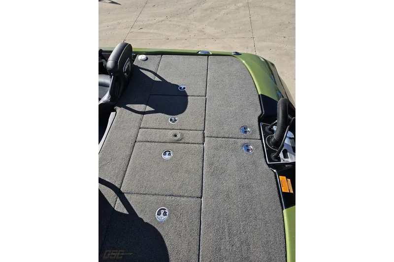 Slide: The Image of 2022 Skeeter FXR21 Apex boat deck with gray carpet and storage compartments. - 53