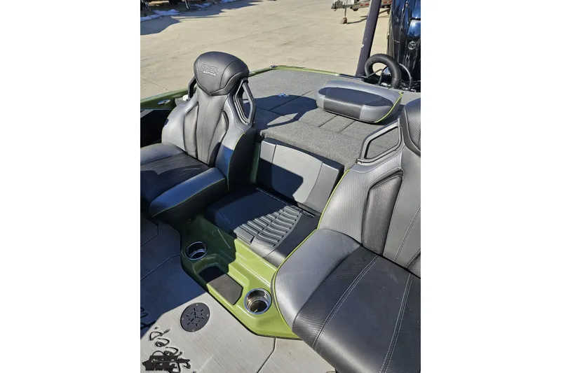 Slide: The Image of 2022 Skeeter FXR21 Apex boat interior with sleek black and green seating. - 56