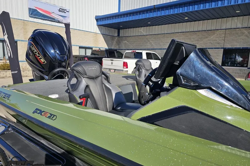 Slide: The Image of 2022 Skeeter FXR21 Apex boat with sleek design and powerful engine, displayed outdoors. - 6