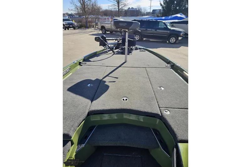 Slide: The Image of 2022 Skeeter FXR21 Apex boat deck with carpeted surface and storage compartments. - 70