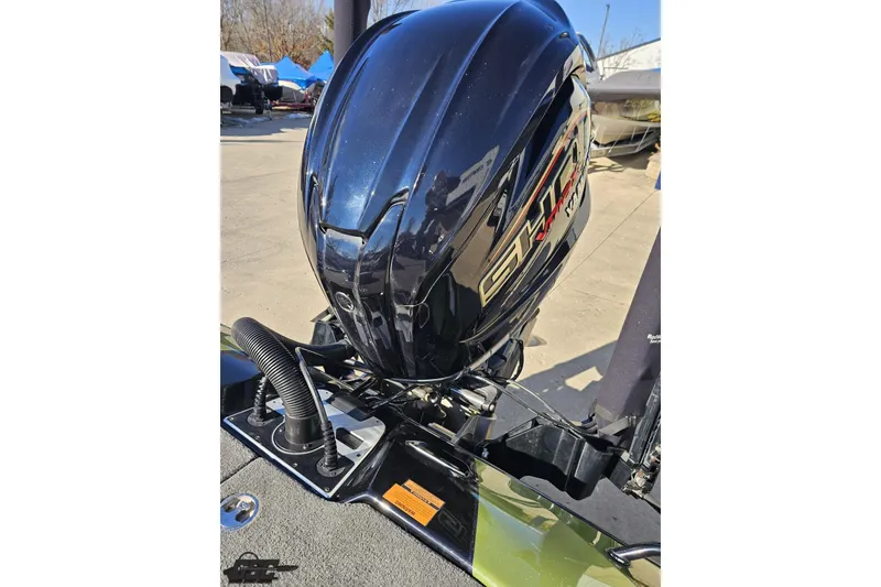 Slide: The Image of 2022 Skeeter FXR21 Apex boat engine, sleek design, outdoor setting. - 86