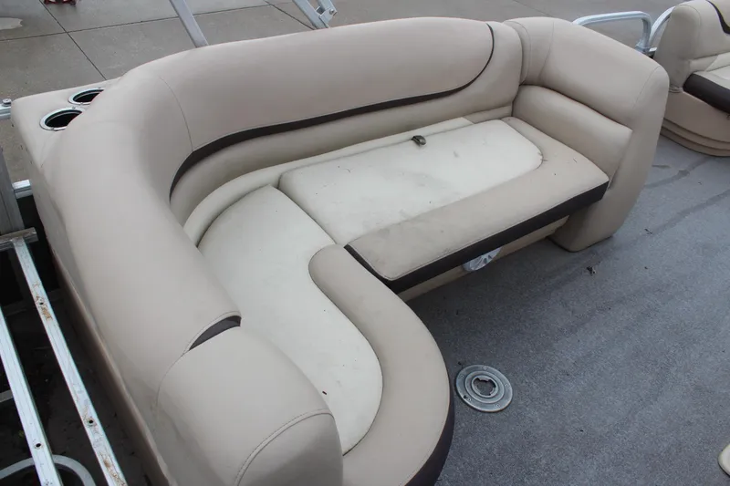 Slide: The Image of 2016 Sun Tracker Party Barge 24 XP3, beige seating with cup holders on deck. - 11