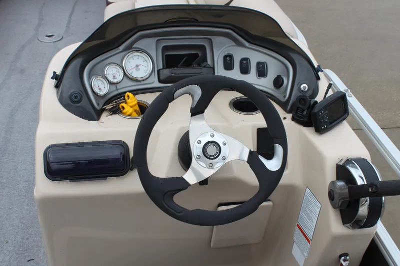 Slide: The Image of Steering console of 2016 Sun Tracker Party Barge 24 XP3 with gauges and controls. - 12
