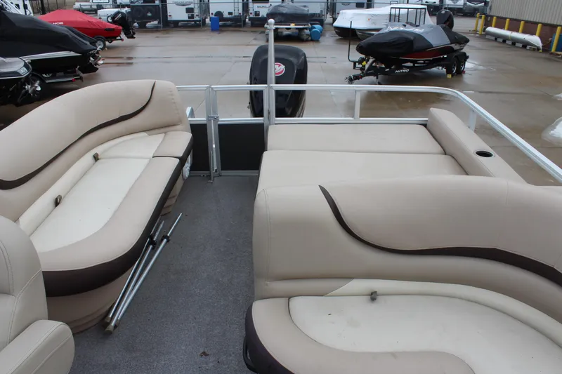 Slide: The Image of 2016 Sun Tracker Party Barge 24 XP3 interior with beige seating and spacious layout. - 14
