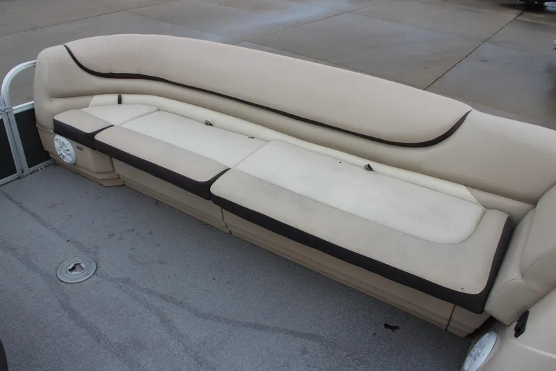 Slide: The Image of 2016 Sun Tracker Party Barge 24 XP3 pontoon boat seating area with beige upholstery. - 17