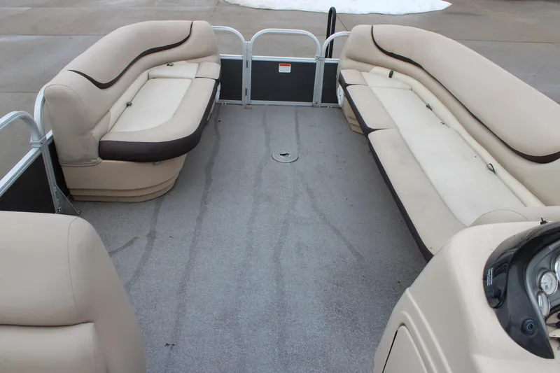 Slide: The Image of 2016 Sun Tracker Party Barge 24 XP3 interior with beige seating and spacious layout. - 19