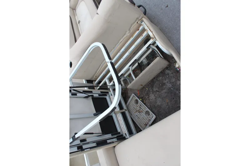 Slide: The Image of 2016 Sun Tracker Party Barge 24 XP3 interior with seating and ladder. - 24