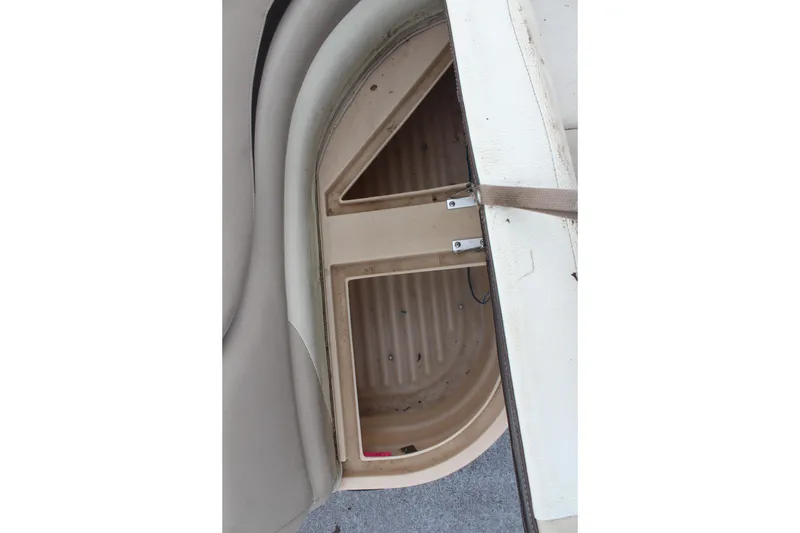 Slide: The Image of 2016 Sun Tracker Party Barge 24 XP3 storage compartment with open lid. - 25
