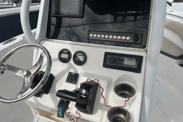 Slide: The Image of Control panel of a 2018 Tidewater 230 CC Adventure boat with steering wheel and gauges. - 17