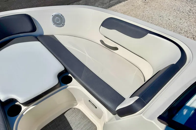 Slide: The Image of 2020 Bayliner VR5 Bowrider OB interior with cushioned seating and cup holders. - 11