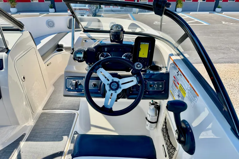 Slide: The Image of 2020 Bayliner VR5 Bowrider OB cockpit with steering wheel and navigation system. - 13