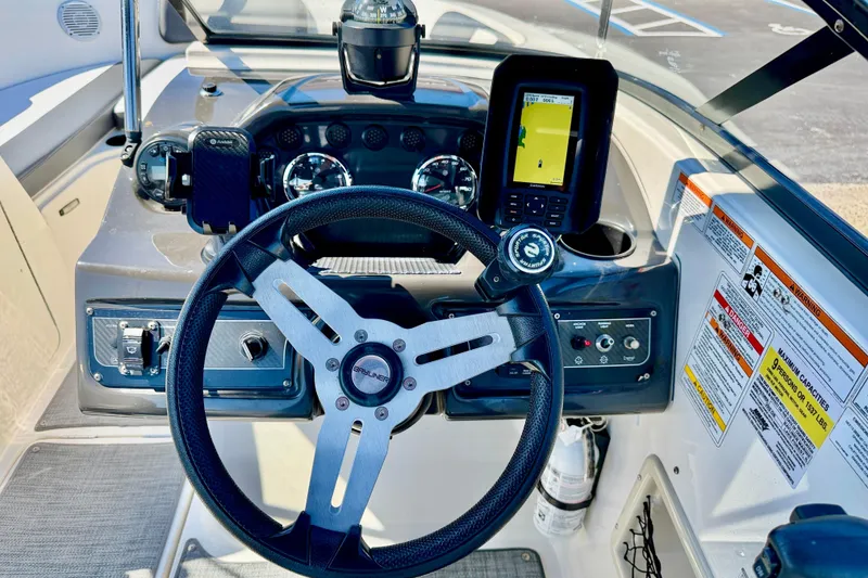 Slide: The Image of 2020 Bayliner VR5 Bowrider OB dashboard with steering wheel and navigation system. - 14