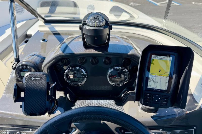 Slide: The Image of Dashboard of 2020 Bayliner VR5 Bowrider OB with navigation and control instruments. - 15