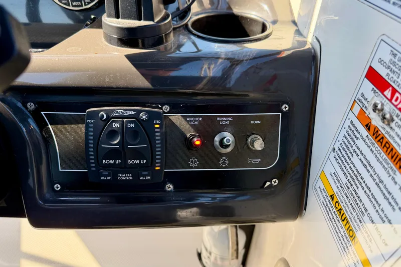 Slide: The Image of Control panel of 2020 Bayliner VR5 Bowrider OB with trim tab and light switches. - 18