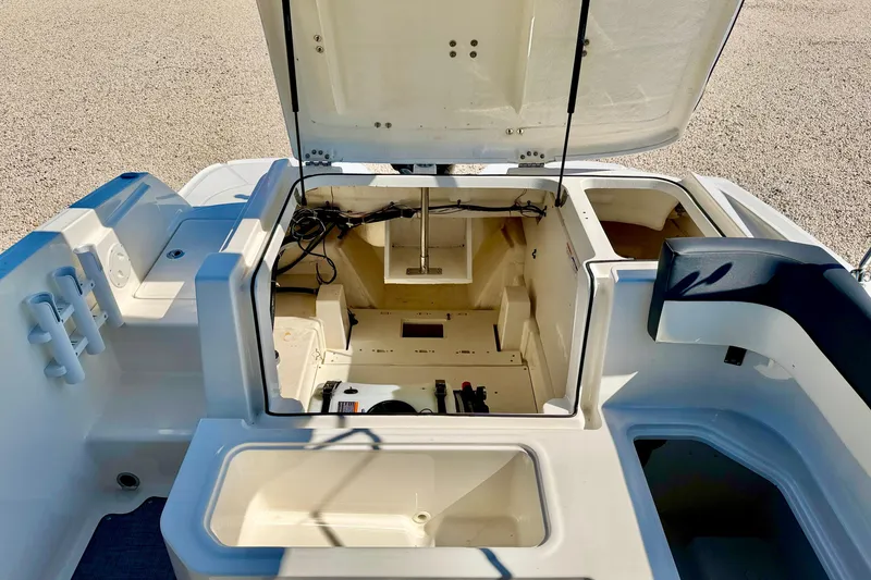 Slide: The Image of 2020 Bayliner VR5 Bowrider OB boat interior with open storage compartments. - 25