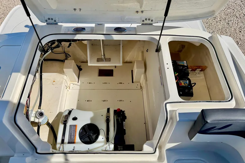 Slide: The Image of 2020 Bayliner VR5 Bowrider OB engine compartment with battery and storage area. - 26