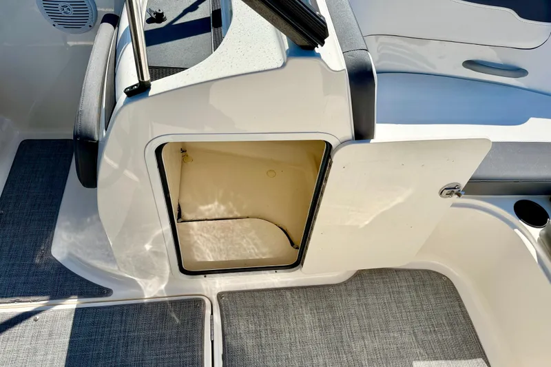 Slide: The Image of 2020 Bayliner VR5 Bowrider OB storage compartment with open door, showcasing interior space. - 29
