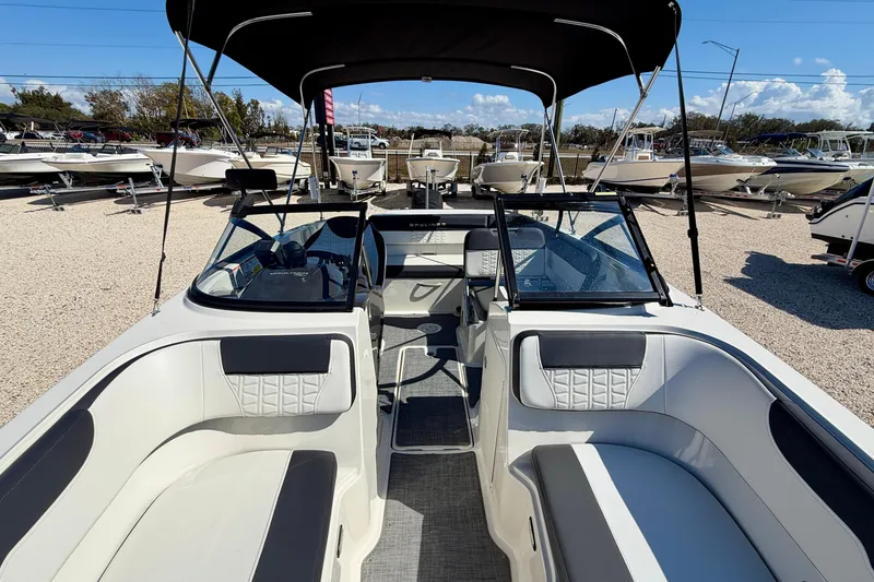 Slide: The Image of 2020 Bayliner VR5 Bowrider OB with spacious seating and canopy, displayed outdoors. - 31
