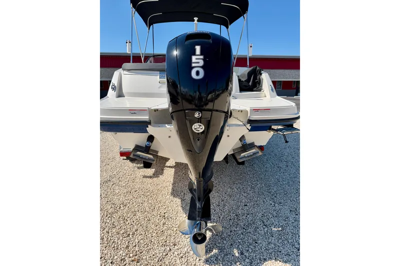 Slide: The Image of 2020 Bayliner VR5 Bowrider OB with 150 HP outboard engine, parked on gravel. - 34