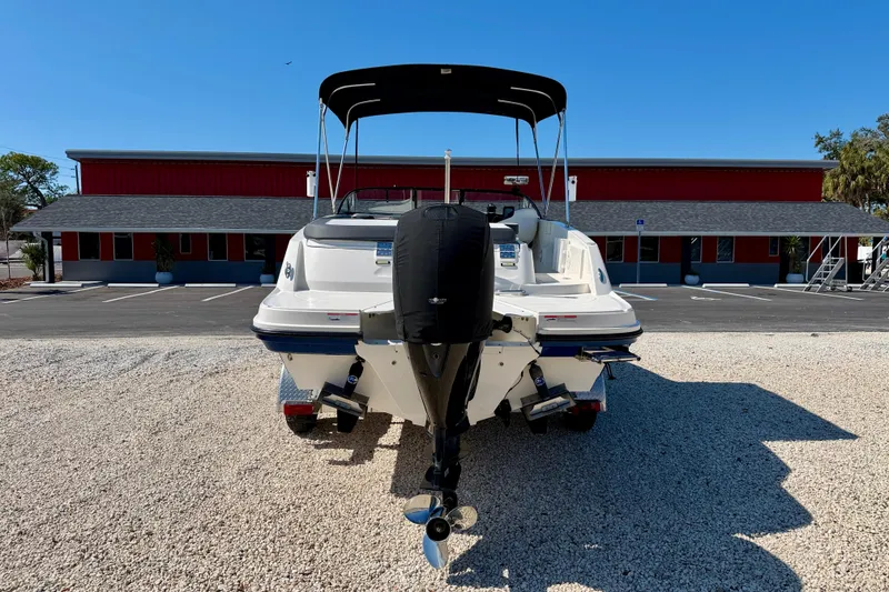 Slide: The Image of 2020 Bayliner VR5 Bowrider OB boat with outboard motor, parked on gravel. - 6