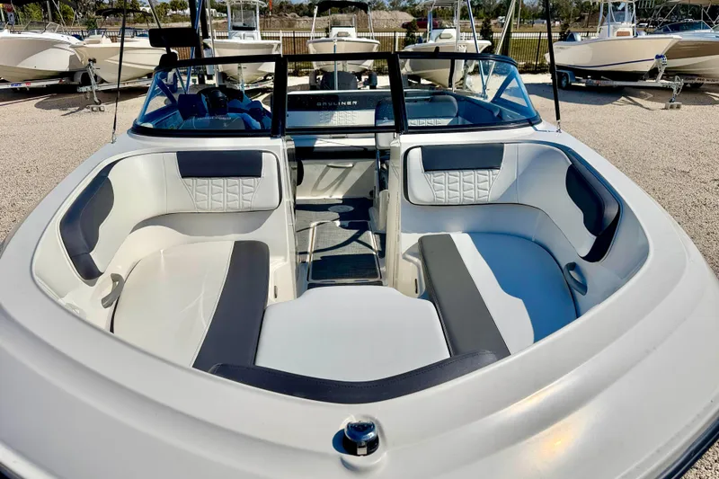 Slide: The Image of 2020 Bayliner VR5 Bowrider OB with spacious seating and modern design in a marina setting. - 8
