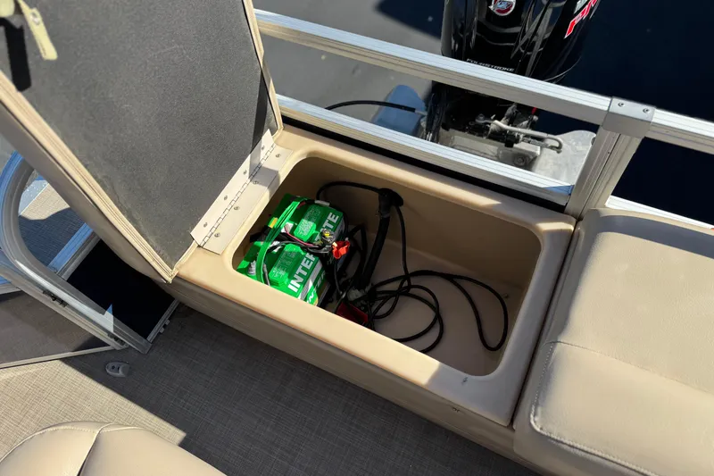 Slide: The Image of 2019 Sun Tracker SportFish 22 DLX boat battery compartment with Interstate battery. - 22