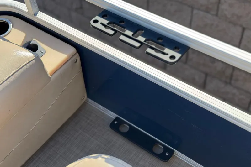 Slide: The Image of Interior view of 2019 Sun Tracker SportFish 22 DLX boat, featuring seating and railing. - 23