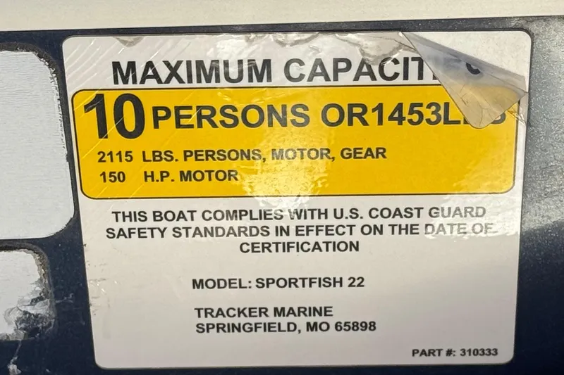 Slide: The Image of 2019 Sun Tracker SportFish 22 DLX capacity label, 10 persons or 1453 lbs, 150 HP motor. - 32