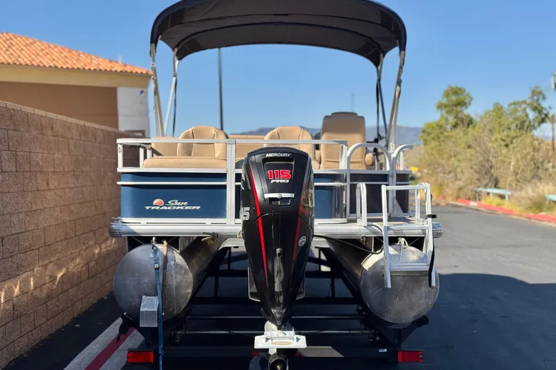 Slide: The Image of 2019 Sun Tracker SportFish 22 DLX pontoon boat with Mercury 115 outboard motor. - 5