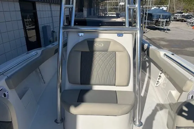 Slide: The Image of 2026 Key West 239 FS boat interior with cushioned seating and stainless steel frame. - 19