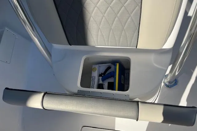 Slide: The Image of 2026 Key West 239 FS boat interior storage compartment with cushioned seating. - 20