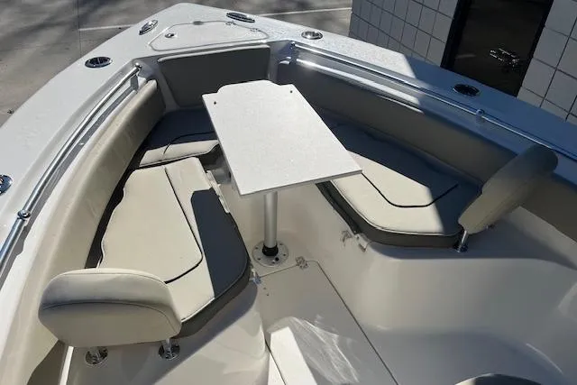 Slide: The Image of 2026 Key West 239 FS boat interior with seating and table setup. - 21