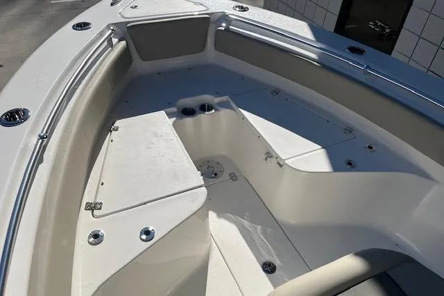 Slide: The Image of 2026 Key West 239 FS boat interior with seating and storage compartments. - 23