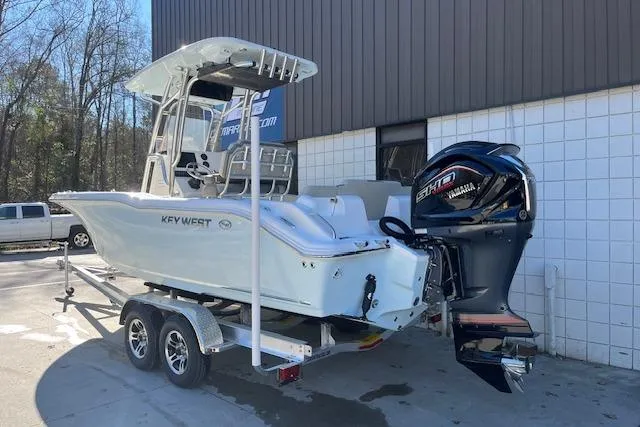 Slide: The Image of 2026 Key West 239 FS boat on trailer with Yamaha engine, parked outdoors. - 3