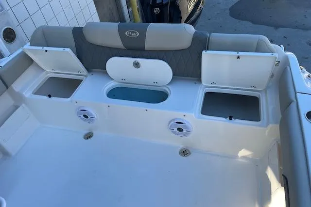 Slide: The Image of 2026 Key West 239 FS boat interior with storage compartments and seating. - 8