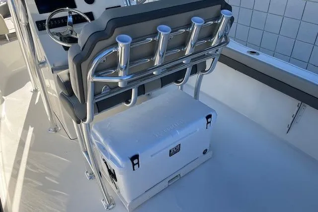 Slide: The Image of 2026 Key West 239 FS boat interior with rod holders and cooler. - 9