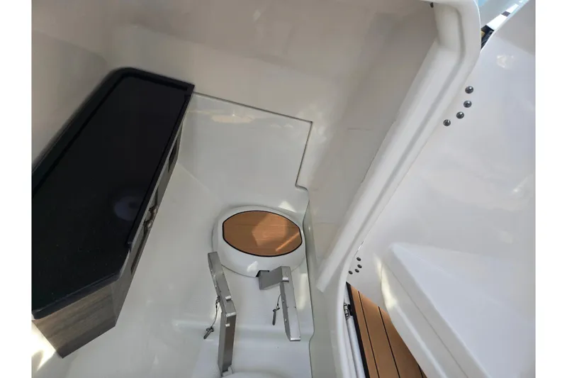 Slide: The Image of 2022 Yamaha Boats 275SD interior cabin with sleek design and modern amenities. - 15