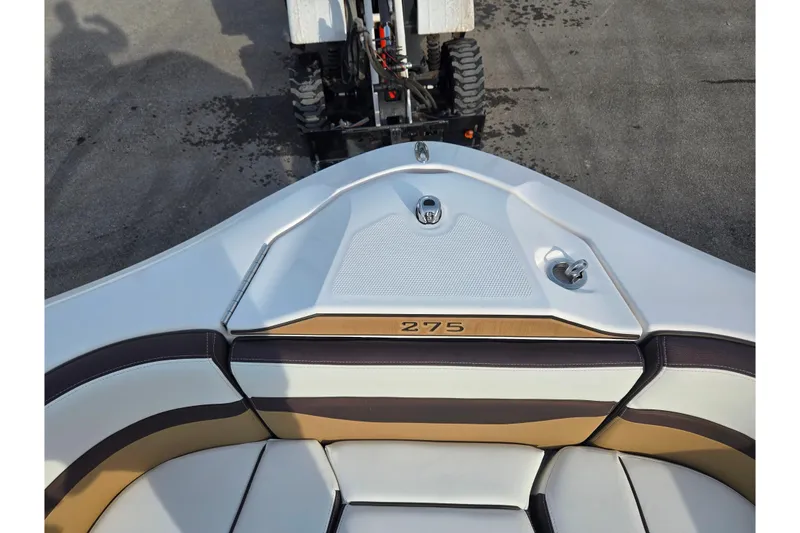 Slide: The Image of 2022 Yamaha Boats 275SD bow seating area with sleek design and modern upholstery. - 20