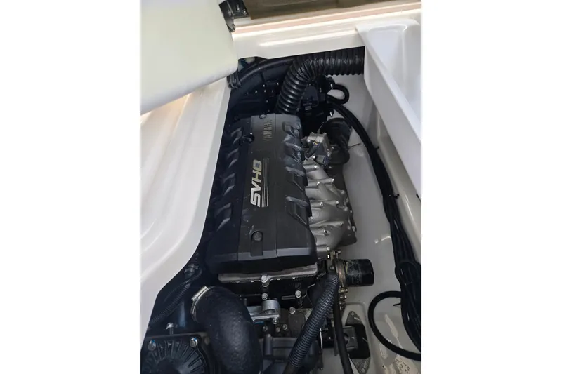 Slide: The Image of 2022 Yamaha Boats 275SD engine compartment with SVHO engine visible. - 28